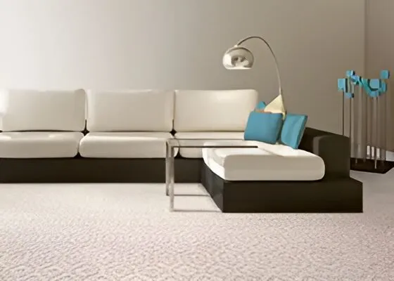 Dynasty wool carpet in a modern minimalist living room with a cream sectional sofa